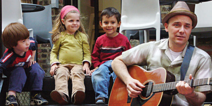 Randy-Kaplan-with-kids_photo-credit-Rachel-Carter-White Randy Kaplan with kids.